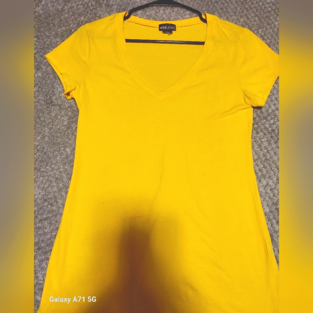 Ladies tshirt by Wet Seal. Mustard yellow and never been washed.